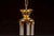 This elegant five-light chandelier balances polished brass hardware with intricate glasswork. At its core is a vertical...