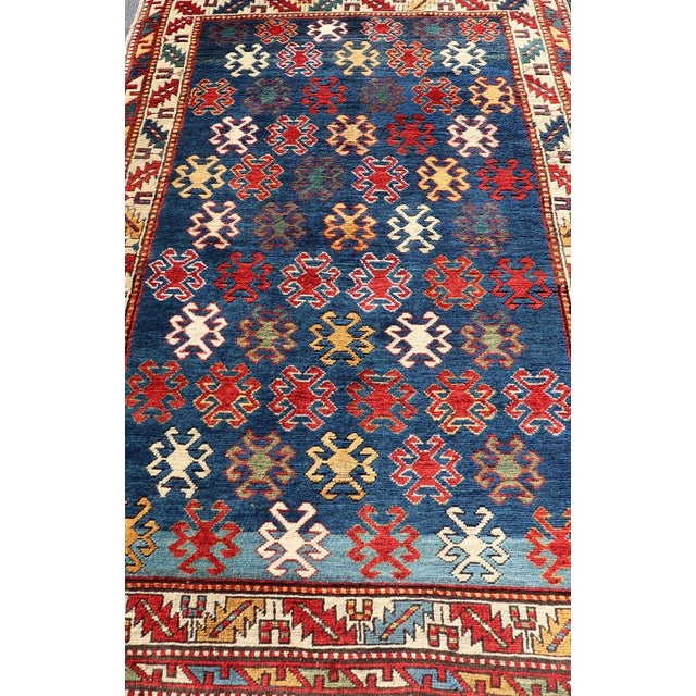 Antique Caucasian Kazak Rug with Geometric And Tribal Motifs Keivan Woven Arts. Keivan Woven Arts / rug /X23-1201-169,...