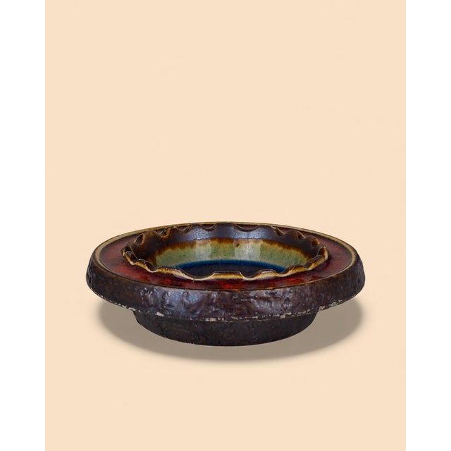 A striking example of "Fat Lava" style pottery. This massive ashtray combines robust ceramic with a stunning center of...
