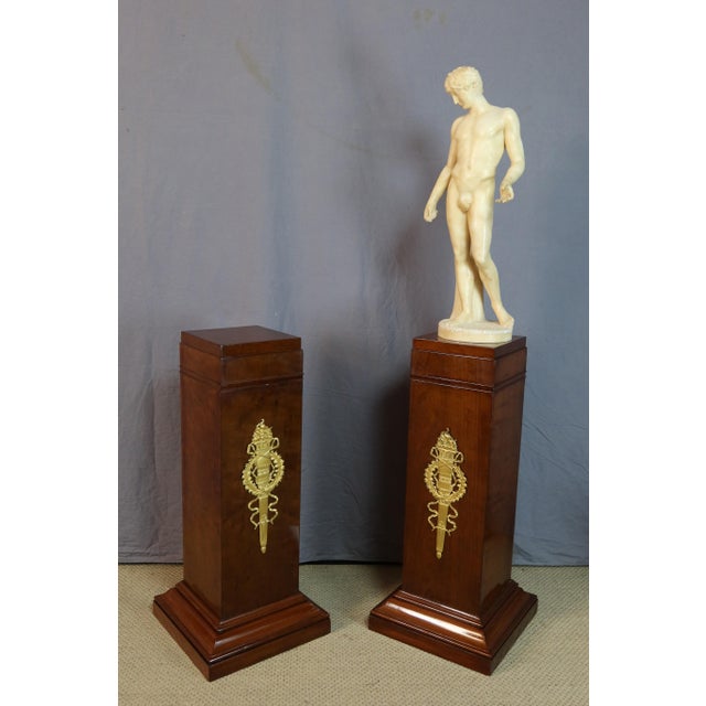 Pair of early 19th-century mottled wood side tables, fully restored. These tables feature beautiful veneer in a classic...