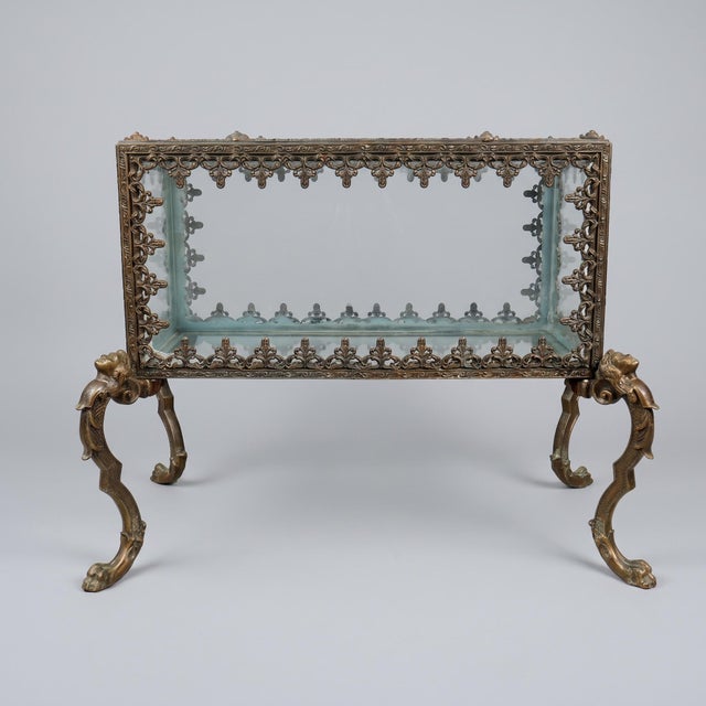 A rare French parlor aquarium in patinated and gilt bronze, with clear glass panels, in a historicist style with Rococo...