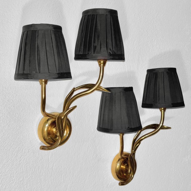 A pair of wall lamps, model 4300, produced by the renowned Swedish manufacturer Bröderna Malmströms Metallvarufabrik in...