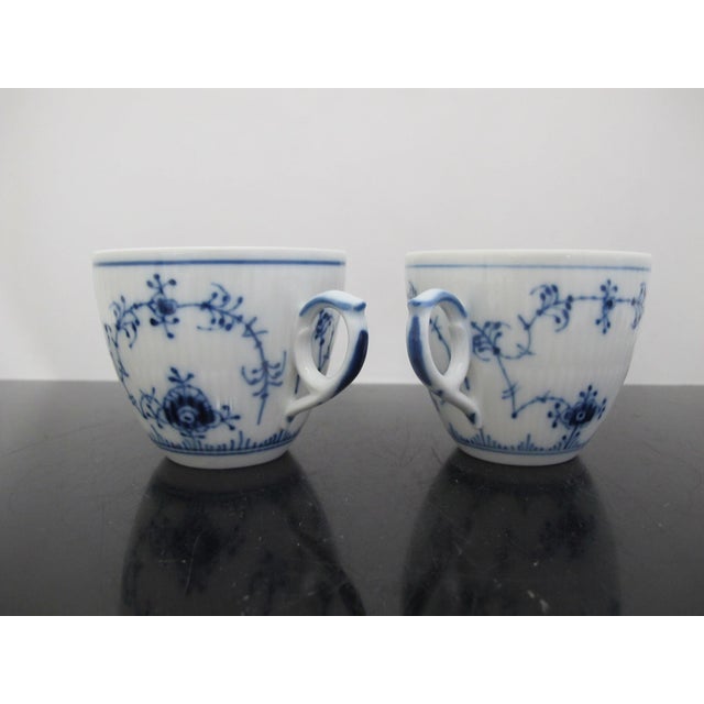 Vintage Royal Copenhagen Denmark porcelain, plain blue fluted cup 081 set of 2. Each measures 3 3/4" x 3" x 2 3/4" tall....