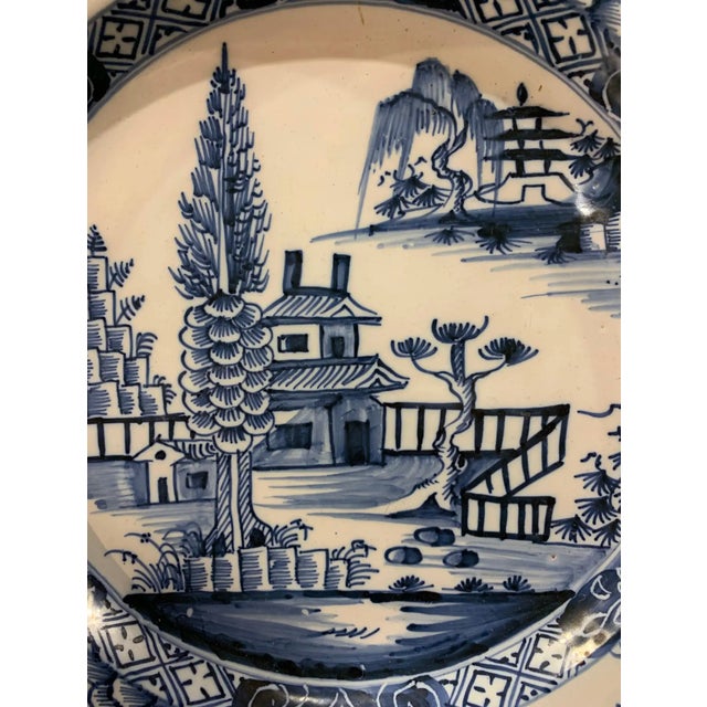 19th-century hand-painted English Delft chinoiserie-decorated charger.