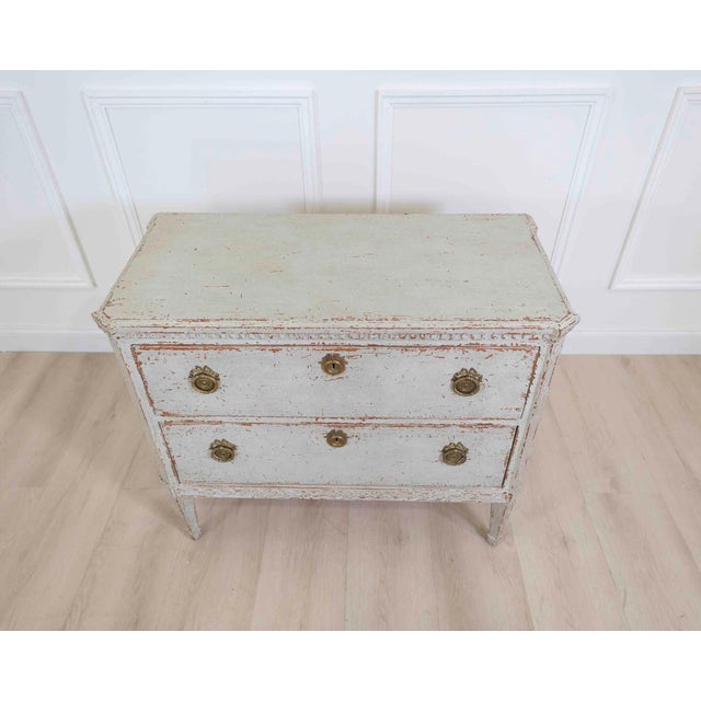Made in Denmark in the nineteenth century, this chest of drawers features decorative carvings. The carved decoration gives...