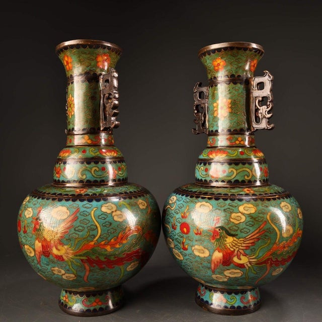 This striking pair of vintage cloisonne enamel vases features a classic baluster form with a flared rim and a bulbous...