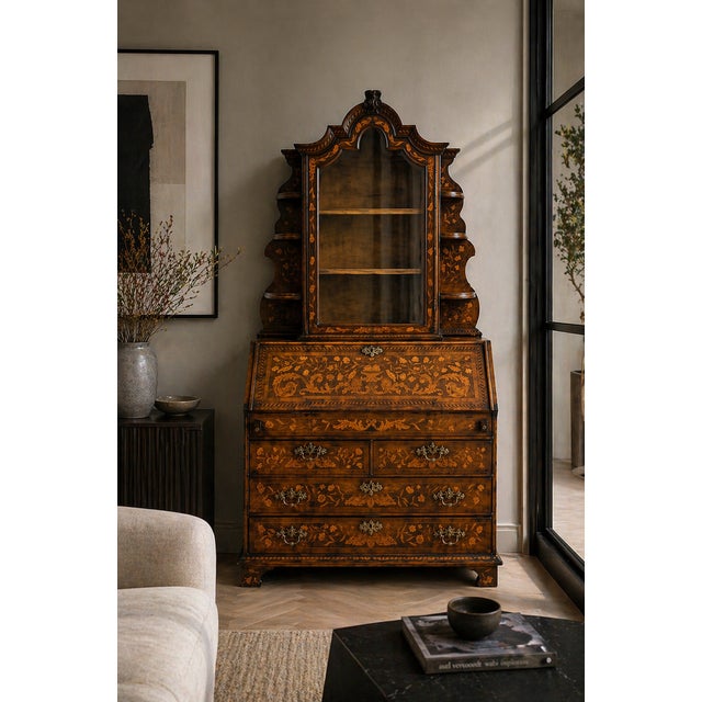 A fine antique Dutch marquetry bureau cabinet in walnut, beautifully decorated throughout with intricate floral inlay. The...
