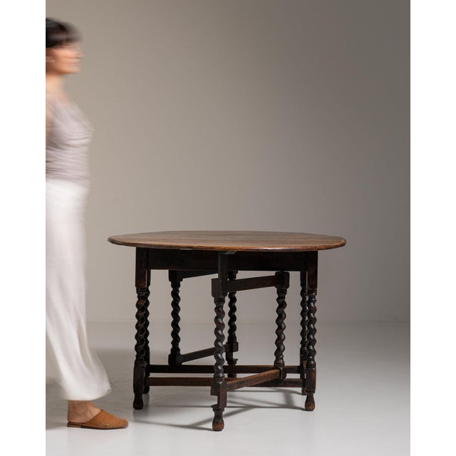 Oak gateleg drop-leaf table in Weathered Honey Oak. Finished in weathered honey oak, this oak gateleg drop-leaf table is...