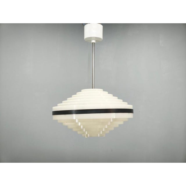 Rare pair of space age ufo pendant lights manufactured in former czechoslovakia during the 1960s. These sculptural...