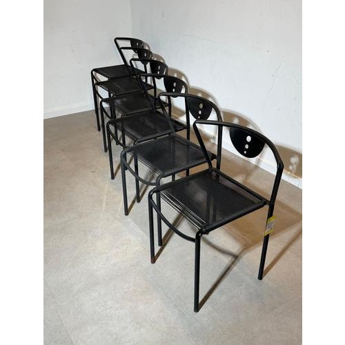 Iconic set of six black ‘Spaghetti’ chairs designed by Giandomenico Belotti . These sculptural dining chairs feature a...