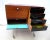 Small teak-finish chest of drawers on casters. Chromed metal structure and functional casters 2 pivoting doors, one of...