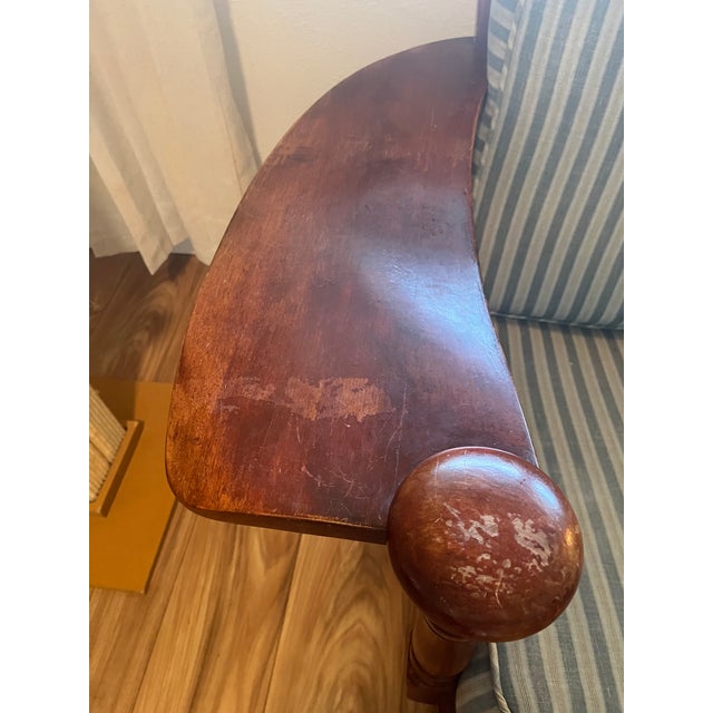 Cushion covers are light blue with thin stripes. They are removable and washable.