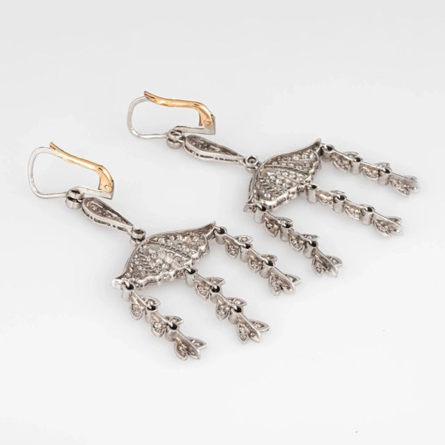 This is part of Chairish’s Fine Jewelry assortment. Elegant pair of vintage diamond drop earrings crafted in 14k yellow...