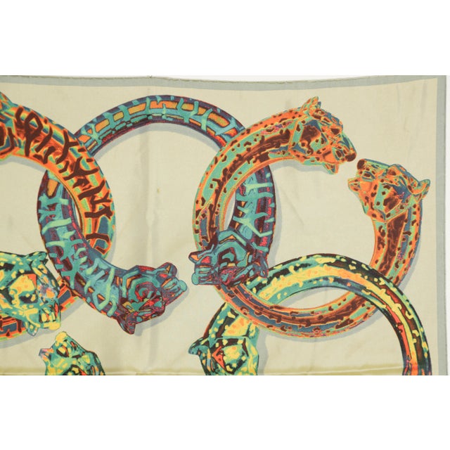 CARTIER Paris in Box Elegant Silk Scarf . Blue border with a gold yellow and orange background with feline and sensual...