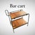 A Rare French Midcentury Modern hand stitched leather bar cart by Jacques Adnet, circa 1955. Adnet had a rare talent for...