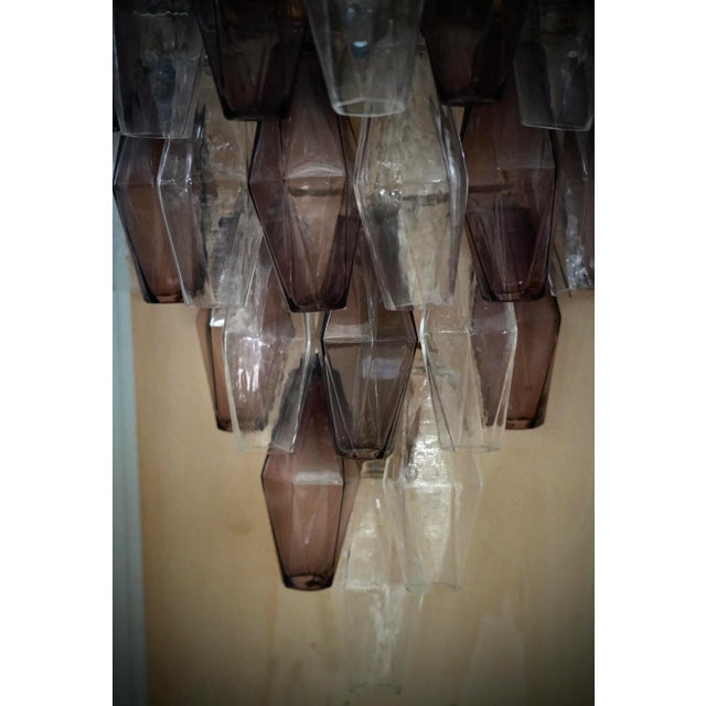 Many beautiful tetrahedrons in classic violet and transparent Murano glass. Rich design for a truly beautiful wall light....