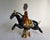 A striking matched pair of Chinese Tang-style pottery figures depicting two riders on spirited galloping horses. Each...