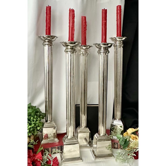 This is for a set of 5 Tall Candle Holders. They are silver plated or perhaps nickel silver and were crafted in India....