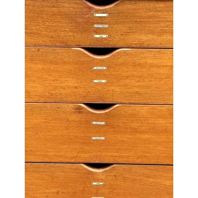 Figured walnut case, with inlaid Greek key fretwork—emblem of Edwardian neoclassical revival; four graduated sycamore...