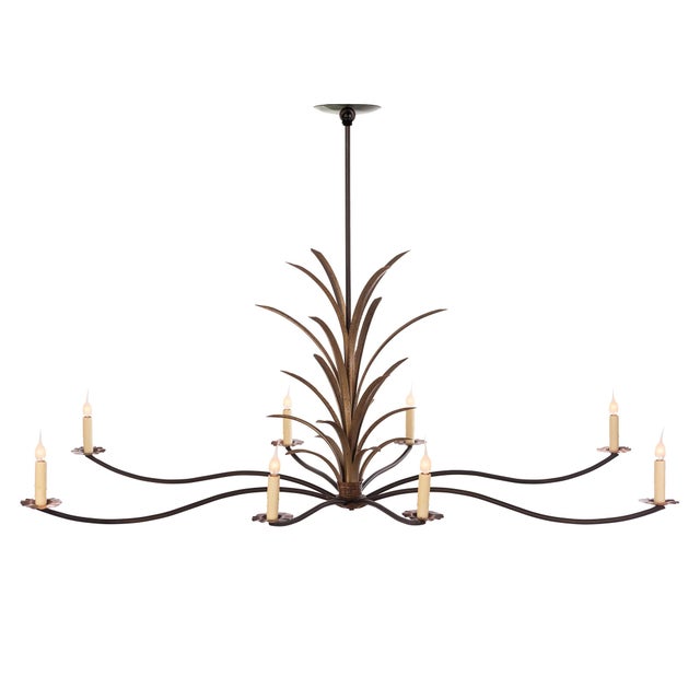 The Daufuskie Chandelier has returned with a new look. The chandelier is an artful piece with long graceful arms and cord-...