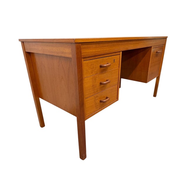 Elevate your workspace with this Vintage Danish Modern Teak Writing Desk, circa 1980s. Crafted with clean Scandinavian...