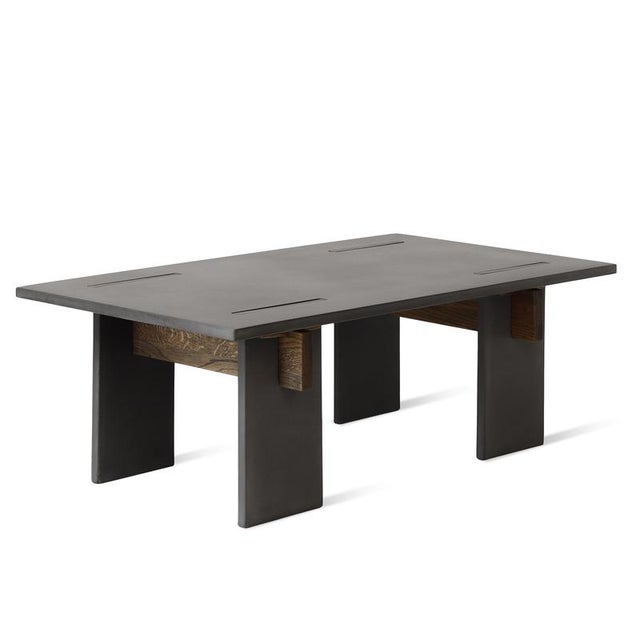 Arnold Dark Concrete and Dark Oak Wedges Coffee Table by Eberhart Furniture Dimensions: D 110 x W 65 x H 38 cm. Materials:...