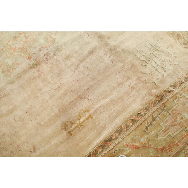 An early 20th-century soft Pink Color Oushak Rug rug no. 8685 Measures: 11'4" x 14'5" Turkish Oushak rugs have become the...
