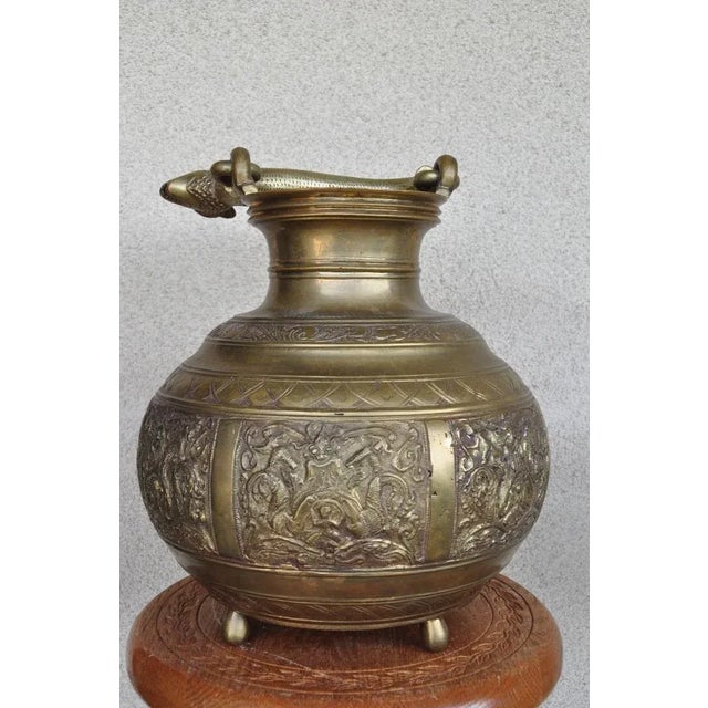(YOU CAN MAKE REASONABLE OFFERS). This is a heavy ceremonial temple water vessel. The solid heavy handle is made in the...