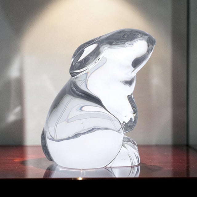 An authentic Baccarat full lead crystal seated rabbit figurine, crafted in France during the late 20th century. This...