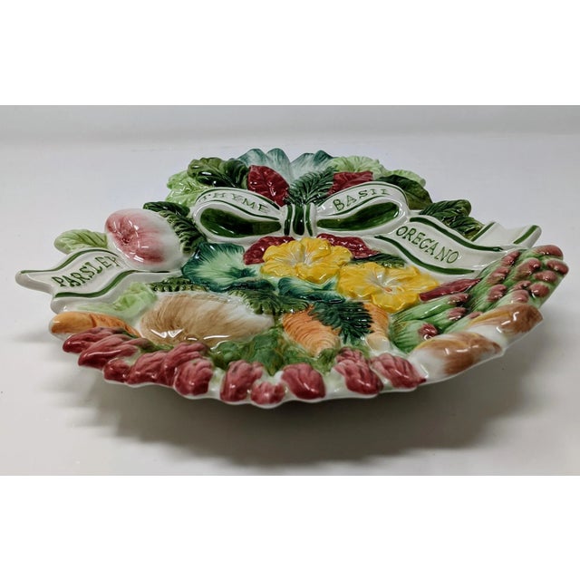 Here is a gorgeous decorative wall plate is from the Herb Garden collection of Fitz & Floyd. It features a bouquet of...