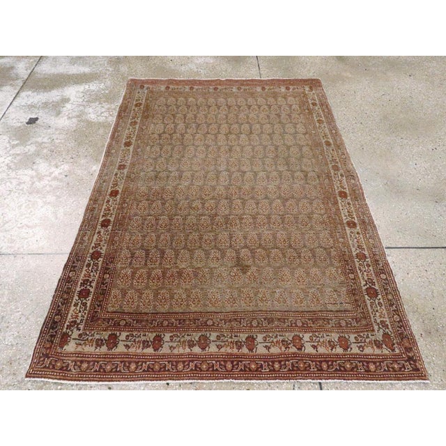 This Early 20th century Persian Tabriz Hagi Jalili rug, measuring 4' 0" x 5' 8", presents a refined example of the master...
