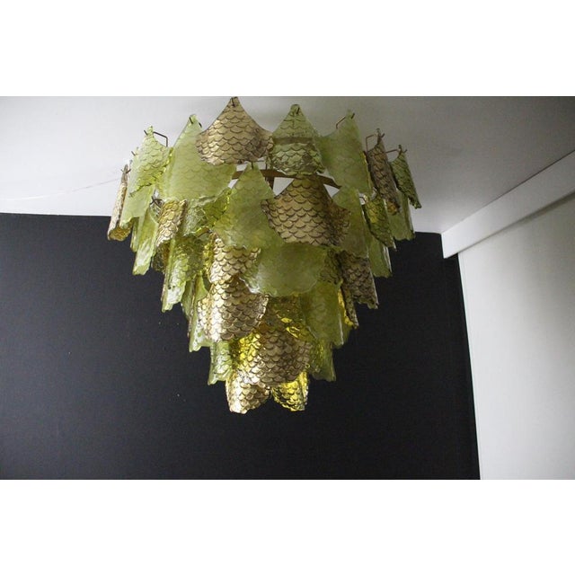 This spectacular chandelier features magnificent, large hand-blown Murano glass elements in two shades of green and gold....