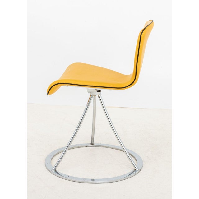 Italian Postmodern Yellow Leather Swivel Chair, atop a chrome tripod support above a circular base. 29.5" H x 20"...