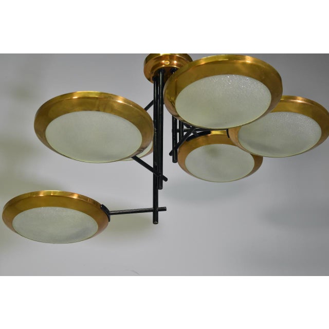 Splendid Stilnovo three-disc brass and glass ceiling lamp, Italy, 1950s. Reference: Botteghe Storiche di Milanesi, Milan,...