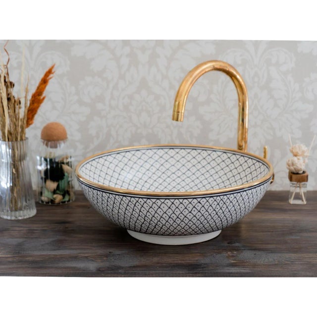 1) Elevate the Beauty of your bathroom with our 14k Gold Rim Sink. This ceramic vessel sink is skillfully handcrafted by...