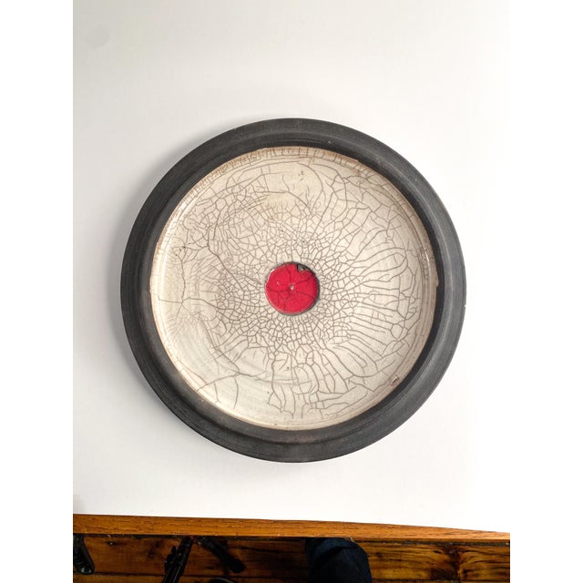 Beautiful Raku studio pottery platter. signed by artist "BRETT" can be used as a hanging display or table centerpiece.
