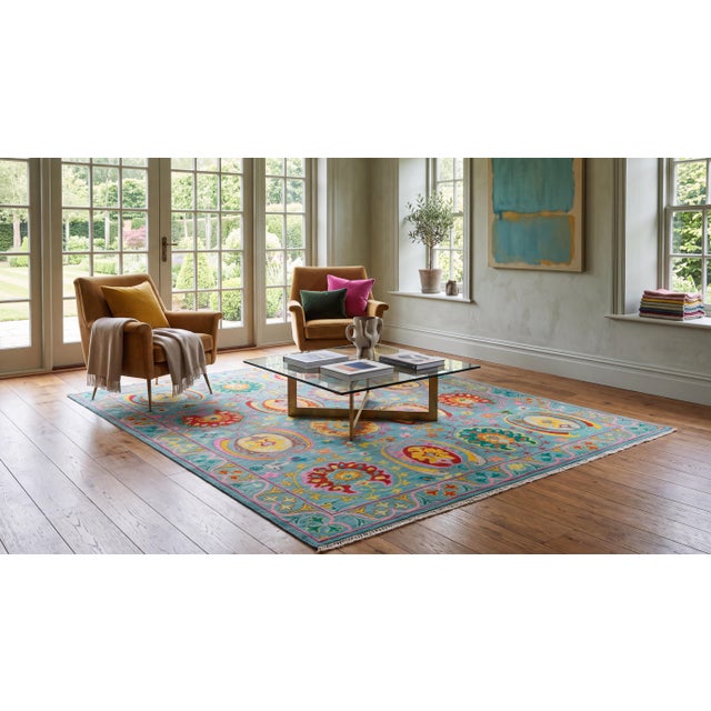 Bring joyful luxury and artistic elegance to your space with this stunning contemporary Oushak-style area rug. Hand-...
