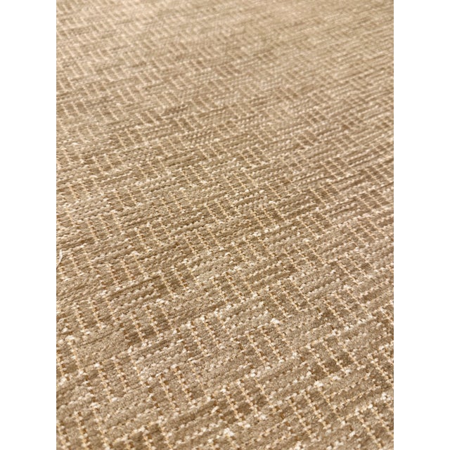 This modern Versatile beige chenille has a geometric design. It has a soft hand and is multipurpose. This fabric is a...