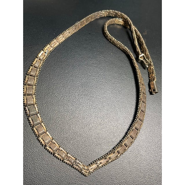 MCM jewelry from Italy marked sterling silver necklace features a articulated chevron design constructed from interlocking...