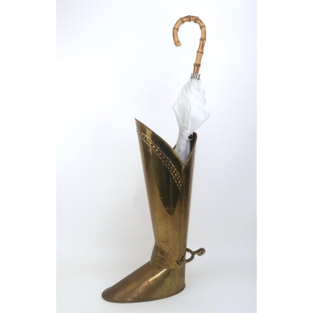 Let the rains begin! Handsome, witty and by all accounts useful, this Mid 20th Century English brass umbrella stand in the...