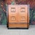 This is a beautiful tall boy dresser by Hellum Furniture Company in the style of James Mont. It features two large doors...