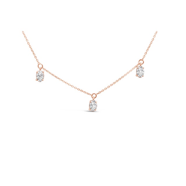Draped in the warm, radiant embrace of 14K rose gold, this exquisite 17-inch necklace captivates the eye with the ethereal...