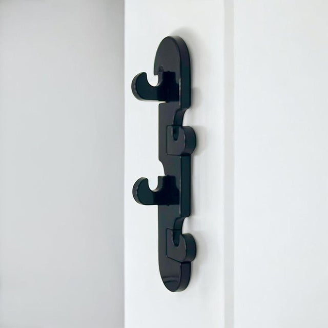 Wall mounted vertical coat hanger produced by Visiva Milano in Italy during the 1970s. Executed in molded plastic, this...