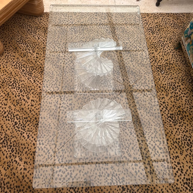 A spiral stacked two part sculptural lucite coffee table with a glass top in the manner of Karl Springer. Circa 1970’s....