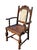 A handsome set of six early 20th-century Jacobean Revival dining chairs crafted in richly toned oak and featuring...