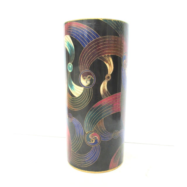 Vintage modern enamel cylinder. Chinese modern enamel with a geometrical pattern of medallions and arcing swirls around...