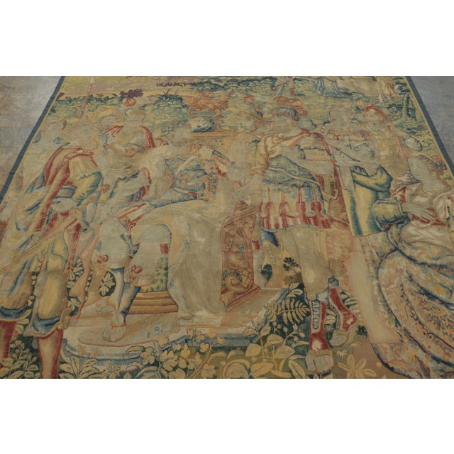 Woven in wool and natural silk circa 1600–1630, this 7x8 antique Flemish tapestry portrays a Roman imperial scene with...