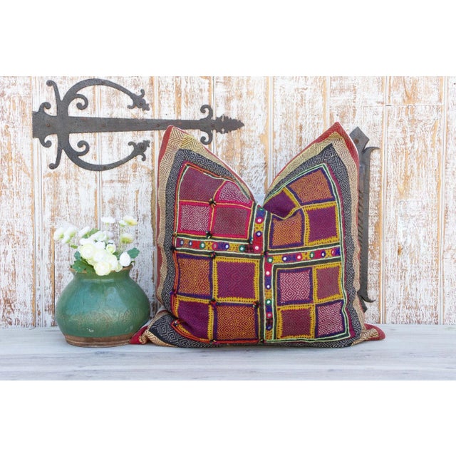 Quilted by the gypsy woman of the Saami community often reusing fabrics from clothing. This antique tribal pillow feature...