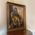 An exquisite original oil painting depicting a seated woman with dark hair dressed in a green garment draped in a gold...
