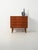 1960s Nordic teak chest of drawers with carved handles, slender turned legs, and a warm, enveloping grain. This 1960s...